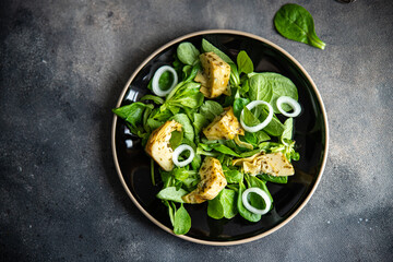 artichoke salad green lettuce leaves mix fresh healthy meal food snack diet on the table copy space food background rustic top view keto or paleo diet veggie vegan or vegetarian