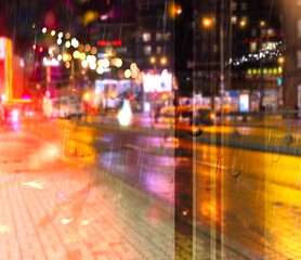 city night light  street reflection  car traffic buildings blurred light red yellow bokeh vew from window urban  holiday  lifestyle