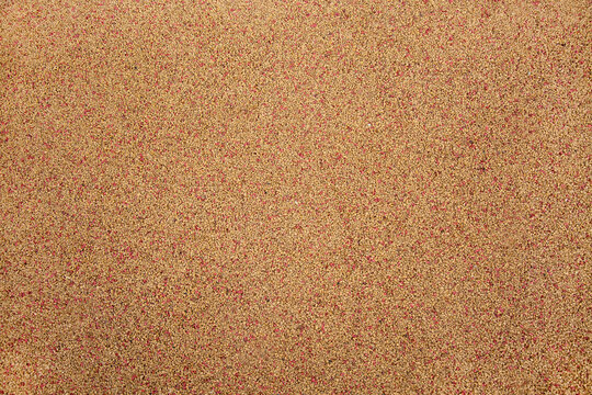 The background is made of rubberized coating used on playgrounds and sports grounds in gray. Backgrounds design textures.