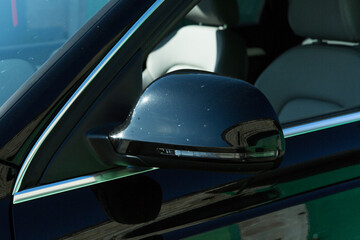AUDI Q3 in black. Subcompact luxury crossover Audi Q3. Side mirror view