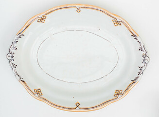 Old porcelain plate with yellow pattern