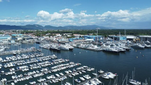 Aerial pull over the busy marina in Viareggio, Italy. 