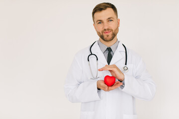 The male cardiologist doctor holding heart on white background