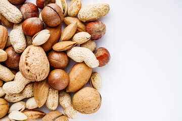 set of different nuts on a white acrylic background