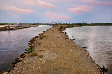 Sunset the fishing port of Illa del Mar, in the Fangar bay at the mouth of the Ebro river, Catalonia, Spain