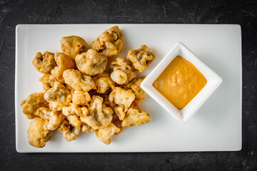deep fried tempura vegetables on a dark background