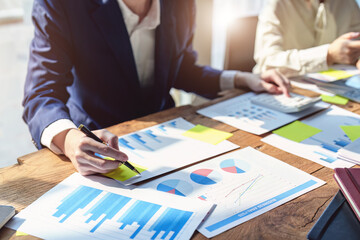 A group of business people working together on a new project to analyze budgets and manage investment risks in today's profit boosting for marketing in the conference room