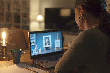 Woman taking art classes online