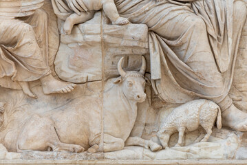 Farm animals carved in ancient roman marble wall showing a domestic scene