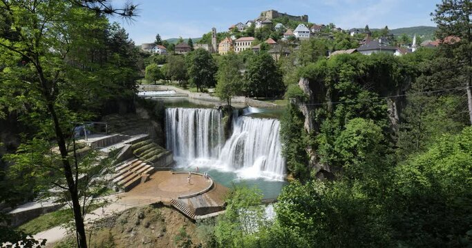 Pliva Waterfall in Jajce, Bosnia and Herzegovina. Holidays and travel. Water. Vibrant colors. Scenic place and viewpoint. Historical town. Tourist destination. 
