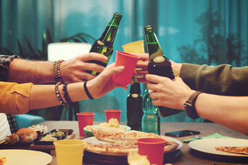 Friends eating and toasting together