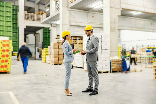 A businesspeople in a warehouse and discussing about business,