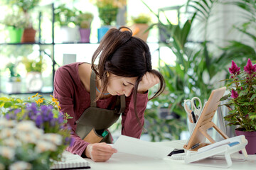 Worried business owner checking bills