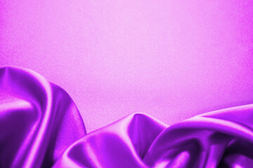Purple pink silk satin. Soft wavy folds. Shiny fabric. Luxury background with space for design,...