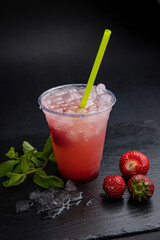 Lemonades in transparent glasses on a black background
