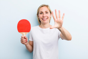 pretty blonde young adult woman. ping pong concept