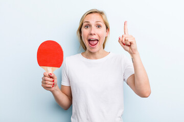 pretty blonde young adult woman. ping pong concept