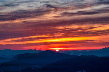 Scenic view of mountains against sky during sunrise