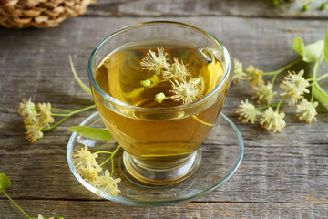 A cup of herbal tea with linden flowers