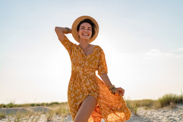 stylish attractive slim smiling woman on beach in summer style fashion trend outfit