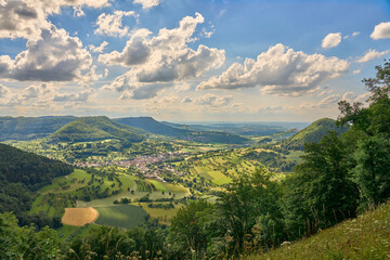 panoramic landscape at  at a viewpoint on the Swabian Alb above village of Neidlingen,...