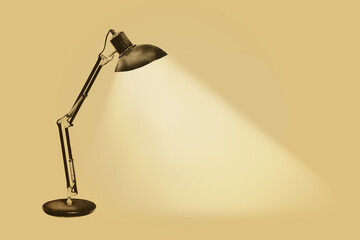 Vintage rusty desk lamp with flexible arms isolated on a white background