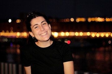 Fototapeta premium portraying in a young woman in spontaneous moments, when she smiles