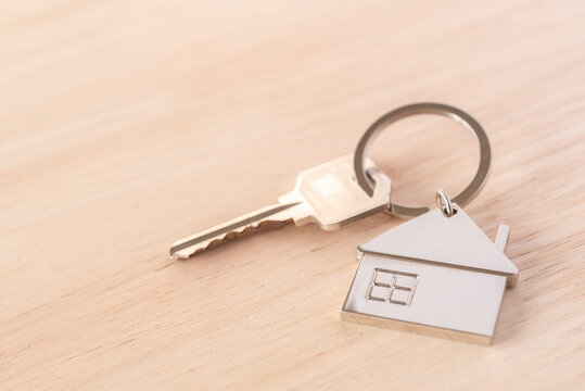 Metal Key House On Wooden Table