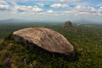 Sigiriya mountain and Pidurangala rock among the dense forest on the island of Sri Lanka. Tropical...