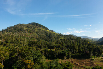 Fototapeta na wymiar Top view of mountainous province with villages and agricultural lands. Sri Lanka.