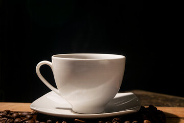 ceramic coffee cup among the coffee beans