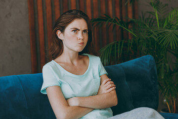 Young unhappy thoughtful upset minded pensive confused caucasian woman she 20s wearing casual...