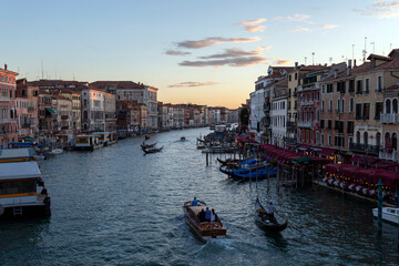 Fototapeta na wymiar Sunset over the Grand Canal, view from Rialto Bridge on a summer evening