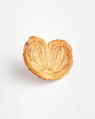 Crunchy heart-shaped cookies. Delicious palm pastry isolated on white background.    