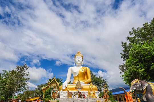Mae Hia,Chiang Mai,Northern Thailand on Septemmber 13,2019:Sitting Buddha Statue at Wat Phra That Doi Kham.