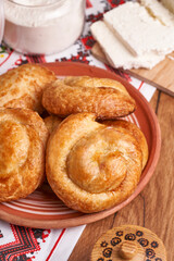 Freshly baked homemade pies with feta cheese, popular moldavian food served as snack or appetizer.                                           