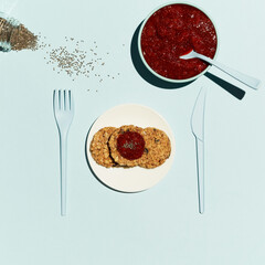 Granola bar. Healthy sweet dessert snacks. Granola cereals bar with nuts and strawberry jam on a blue background.