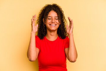 Young Brazilian woman isolated on yellow background joyful laughing a lot. Happiness concept.