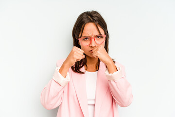 Young hispanic woman isolated on blue background yawning showing a tired gesture covering mouth with hand.