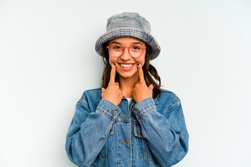 Young hispanic woman isolated on blue background screaming, very excited, passionate, satisfied with something.