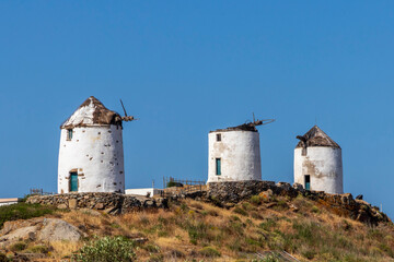 Fototapeta na wymiar Old abandoned windmil at Naxos. Greece