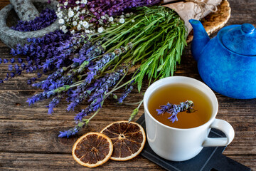Fresh lavender tea on the table. Herbal tea in the mug.  