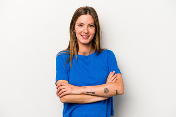 Young caucasian pregnant woman isolated on white background who feels confident, crossing arms with determination.