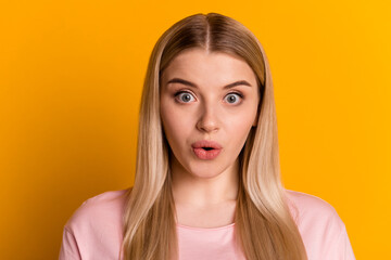 Photo of young impressed woman unexpected information face reaction isolated over yellow color background