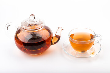 Composition with cup of jasmine tea and flowers on light background