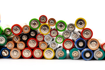 Composition with alkaline batteries on white background. Chemical waste. Top view.
