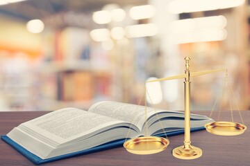 Legal office of lawyers, justice and law concept, scale of justice on a desk in a courtroom,