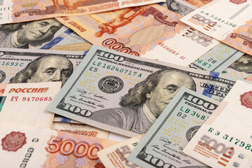 Fototapeta na wymiar US Dollar and Russian ruble. Money background. Currency exhange. Economic crisis. Rouble dollar cash. Hundred dollar bill and 5000 rubles. Business and finance. Russia and USA