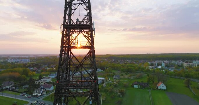 Aerial view of the wooden broadcasting tower in Gliwice with the city of Gliwice in the background. The concept of the largest wooden tower in the world. Wooden construction from a drone.