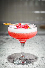 bright colored alcoholic cocktail on a bar background